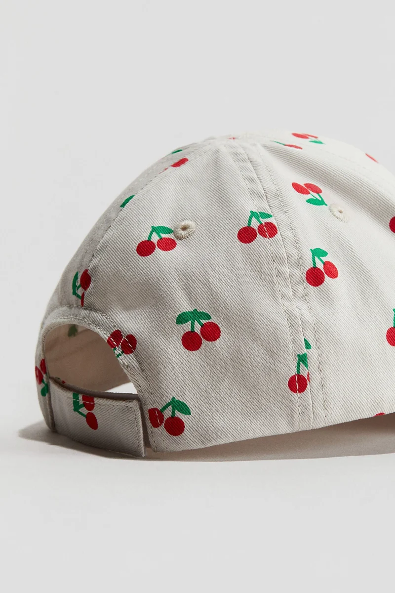 اتش اند ام قبعة قطنية مطبوعة