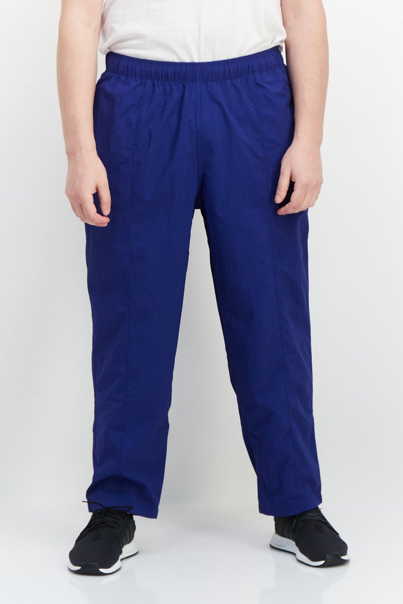 PUMA Men Sportswear Fit Brand Logo Training Track Pant, Blue - Image 1