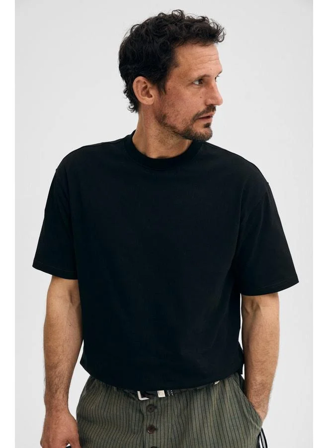 Grimelange DUNNO Men's 100% Organic Cotton Round Neck Regular Fit Black T-Shirt.