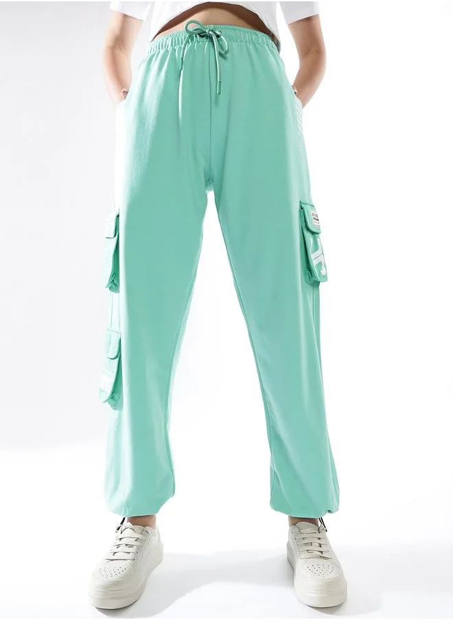 هوبرهولمي Women Track Pants in Multicolor featuring Jogger fit with a colourblocked pattern, no sleeves, regular length, secured with elasicated + drawstring closure, crafted from terry – a must-have for those who love trendy fashion.