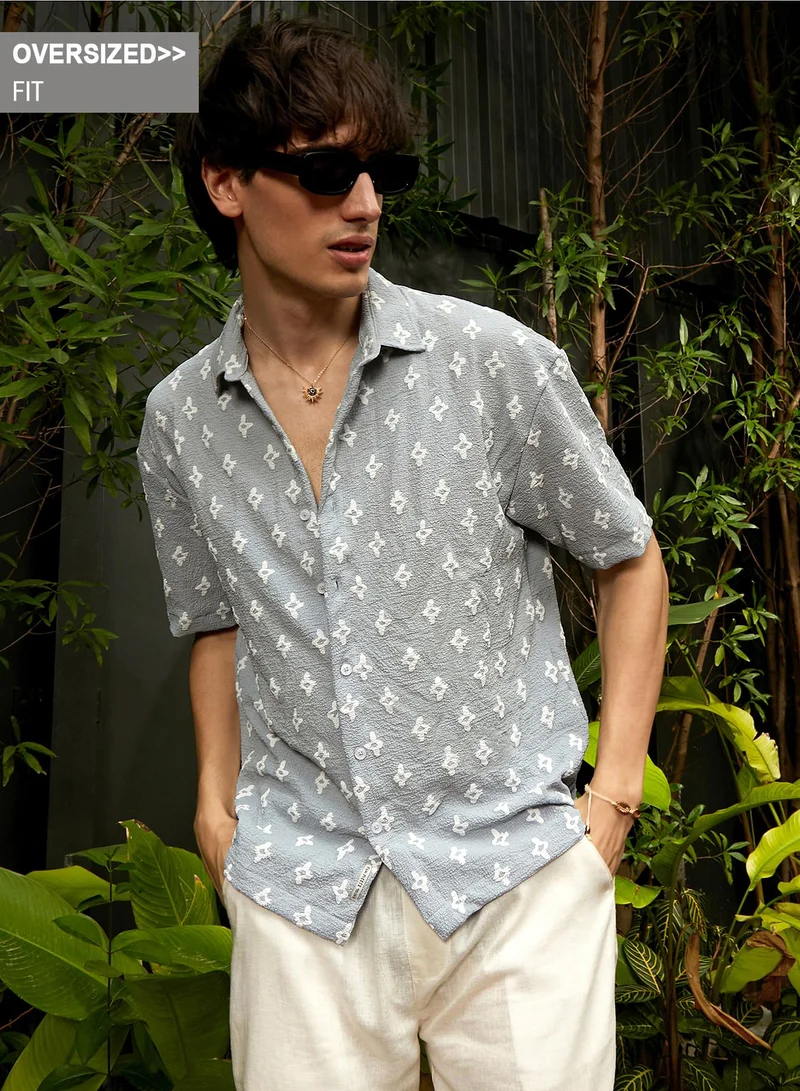 Campus Sutra Campus Sutra Men's Baby Blue Floral-Tactile Oversized Shirt For Casual Wear | Spread Collar | Short Sleeve | Button Closure | Oversized Shirt Crafted With Comfort Fit For Everyday Wear