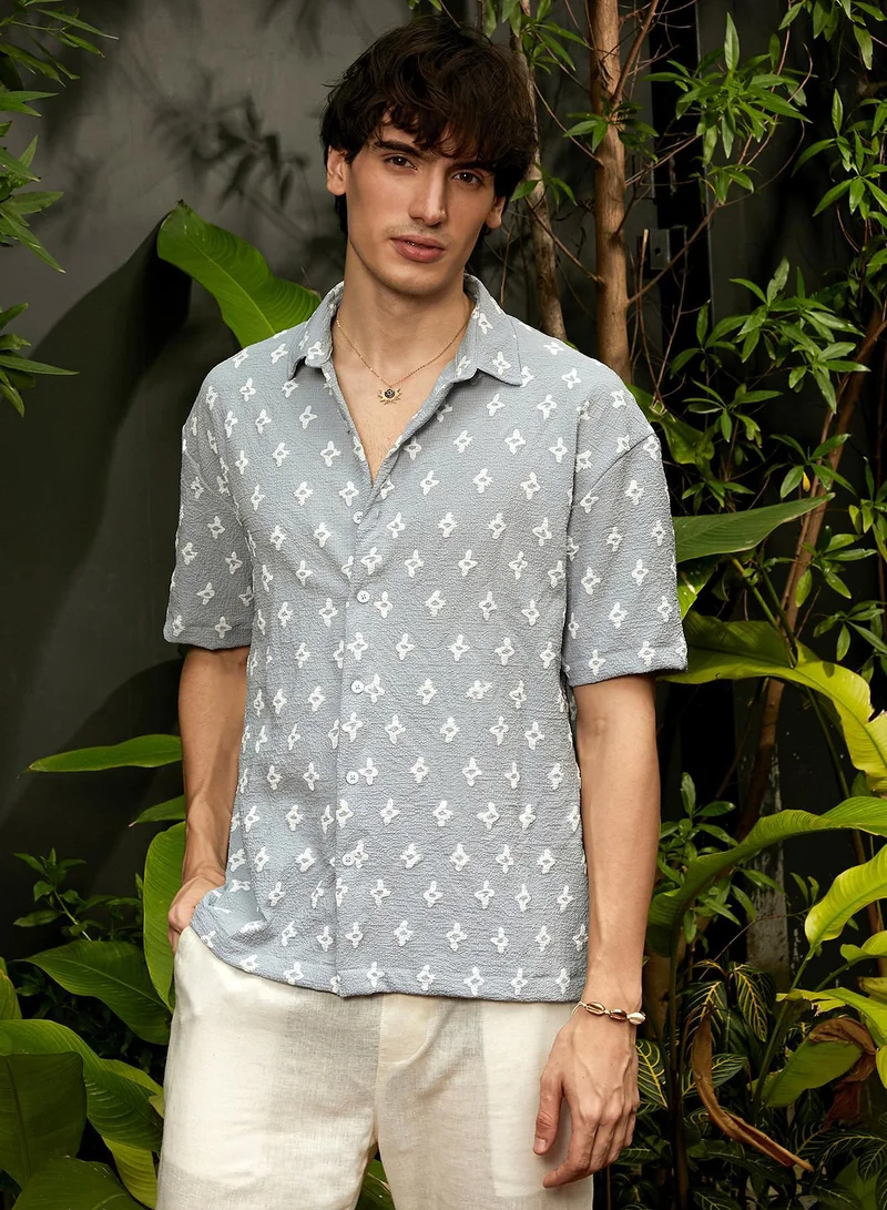 Campus Sutra Campus Sutra Men's Baby Blue Floral-Tactile Oversized Shirt For Casual Wear | Spread Collar | Short Sleeve | Button Closure | Oversized Shirt Crafted With Comfort Fit For Everyday Wear