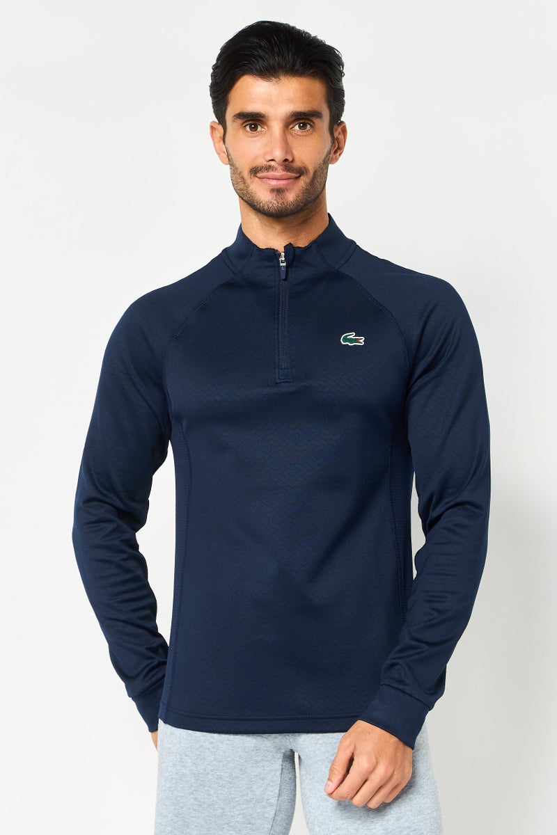 LACOSTE سويت شيرت رجالي بأكمام طويلة وياقة مرتفعة، شعار العلامة التجارية، أزرق داكن - Image 1
