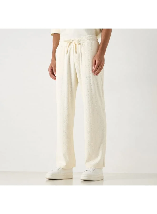 STARTER Starter All-Over Monogram Detail Track Pants with Drawstring Closure and Pockets