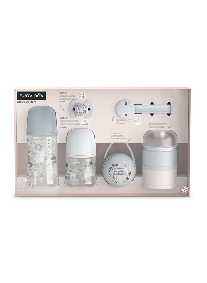 SUAVINEX طقم هدايا ترحيب بالطفل مكون من 5 قطع للمواليد الجدد، زجاجات الرضاعة، مصاصة، حامل المصاصة وموزع الحليب البودرة - أزرق - Image 2