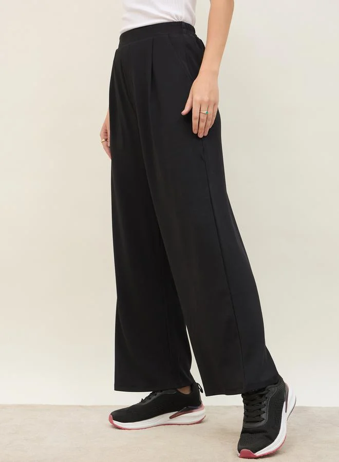 Styli Mid Rise Wide Leg Pants with Elasticated Waistband