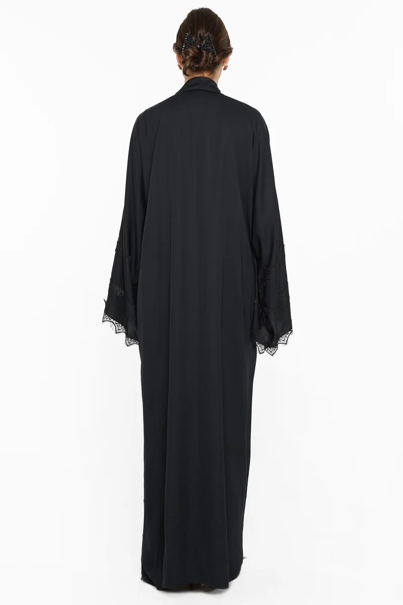 النخبة A simple yet elegant abaya with lace detailing by the sleeves and ends -AJ543A
