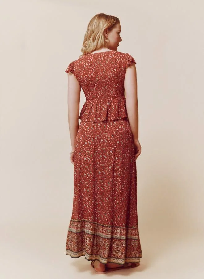 Springfield  Sustainable viscose midi border print skirt with elasticated waistband and drawstring with tassel detail for Women | Best Price UAE