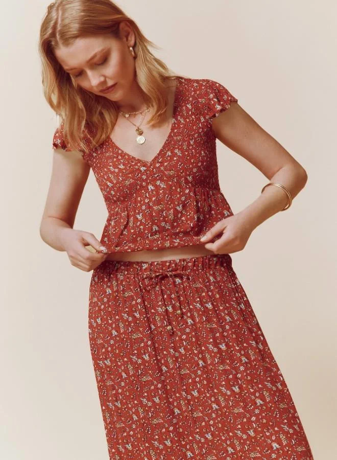 Springfield  Sustainable viscose midi border print skirt with elasticated waistband and drawstring with tassel detail for Women | Best Price UAE