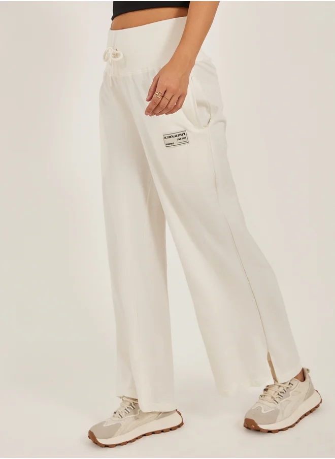 ستايلي Styli Badge Detail Wide Leg Joggers with Side Slit