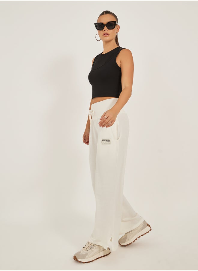 Styli Styli Badge Detail Wide Leg Joggers with Side Slit  - Image 1