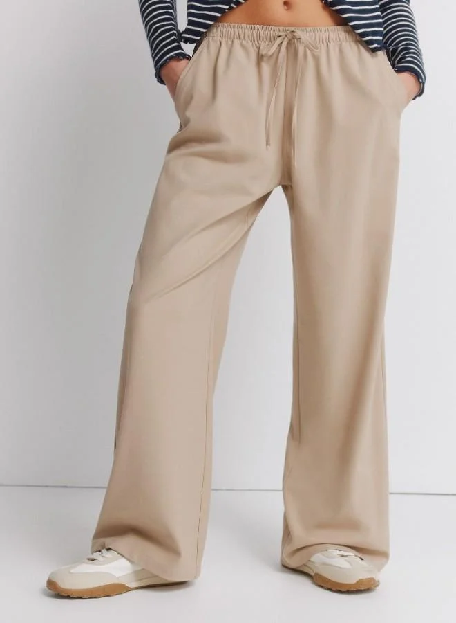 Springfield  Jogger trousers with adjustable drawstring waist and leg width. for Women | Best Price UAE