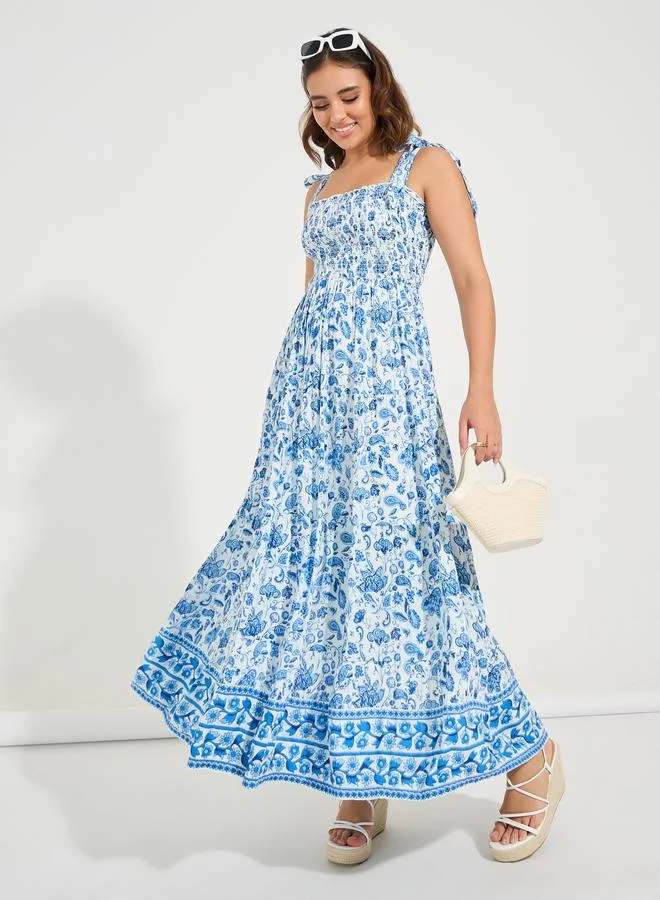 ستايلي فستان ماكسي مطبوع بالزهور بدون أكمام بكسرات ورباط