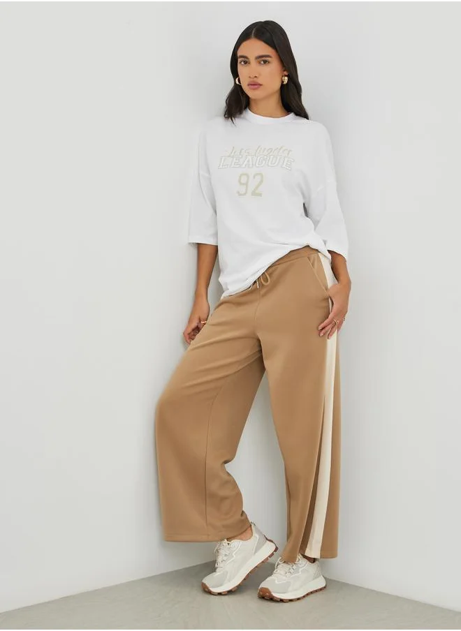ستايلي Styli Slogan Print Exaggerated Shoulder Oversized T-Shirt