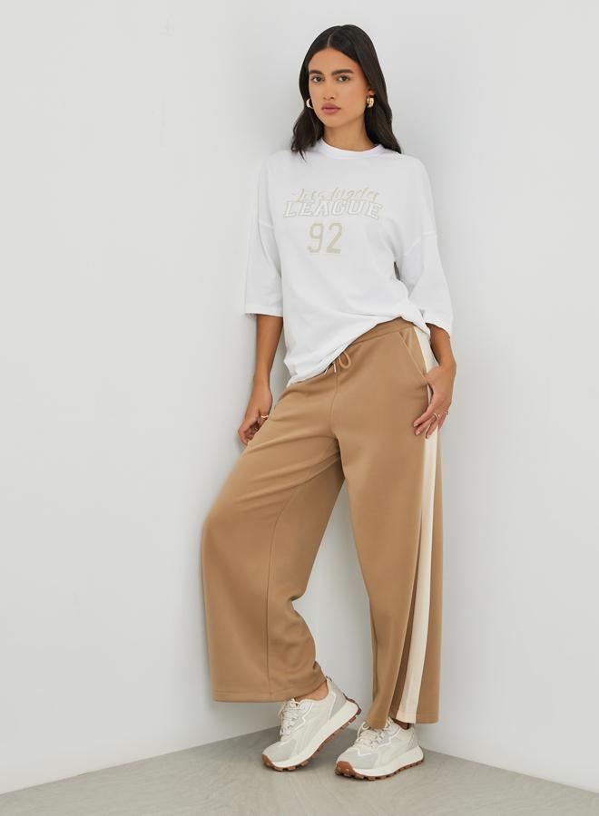 Styli Styli Slogan Print Exaggerated Shoulder Oversized T-Shirt  - Image 2