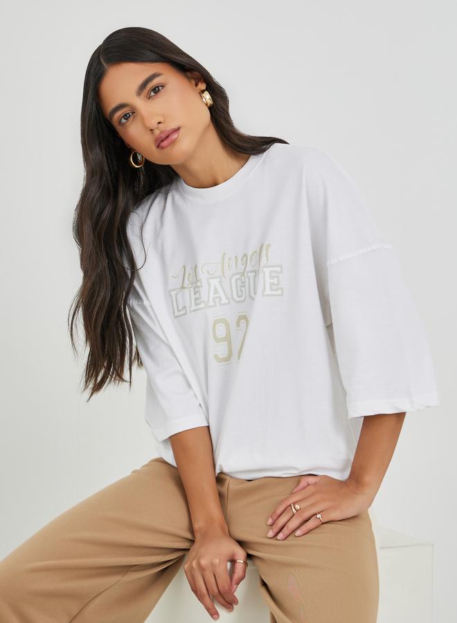 Styli Styli Slogan Print Exaggerated Shoulder Oversized T-Shirt  - Image 1