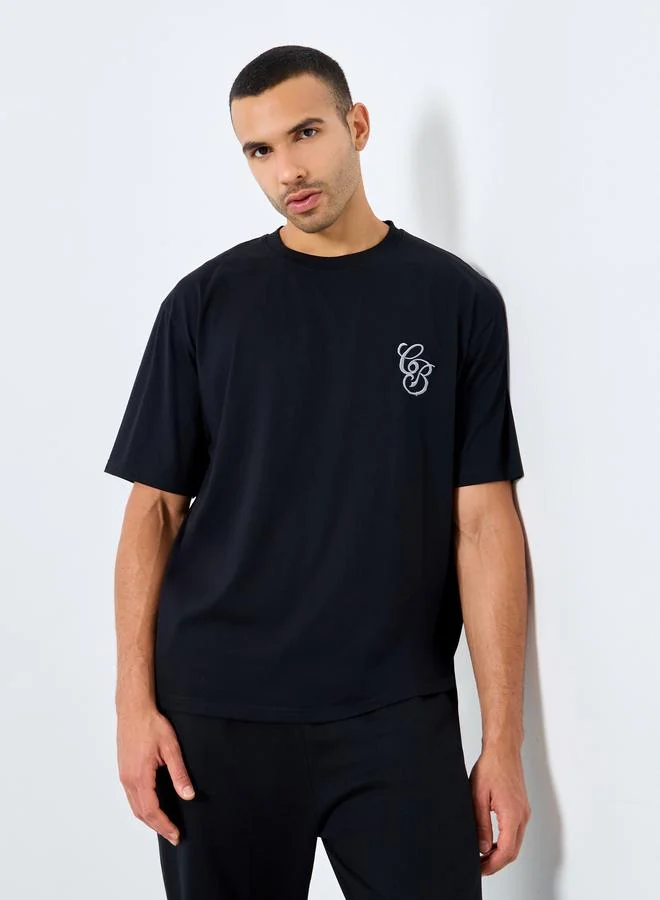 Styli Men Black Embroidered Back Crew Neck T-Shirt