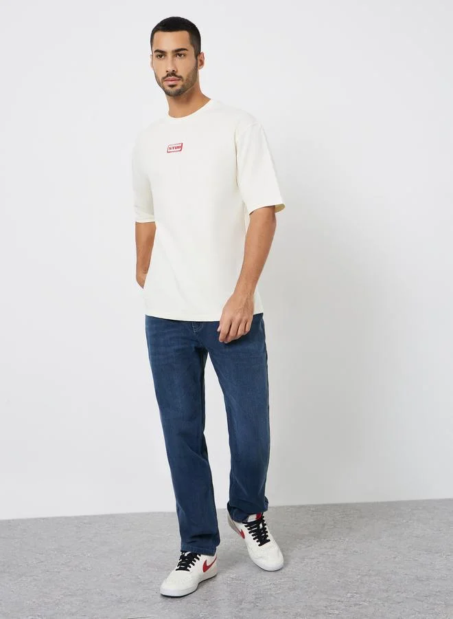 Styli Men Beige Graphic Print Oversized T-Shirt