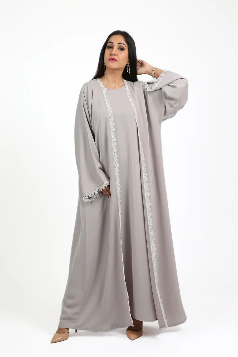 Nikias Nida abaya set with inner lining. Features delicate white lace, soft and comfortable for everyday wear, complete with a matching sheila.