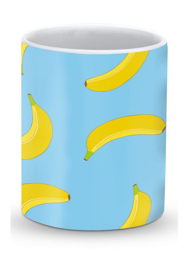 ستايلايزد قدح قهوة فاخر بتصميم الموز المتدحرج أزرق/أصفر 325ملليلتر - Image 1