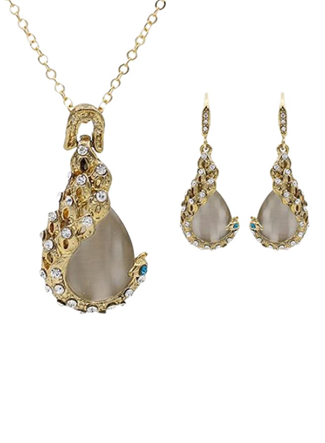 بلولانز طقم مكوّن من أقراط متدلية وقلادة بدلاية على شكل قطرة ماء مرصعين بحجر أوبال وحجر الراين