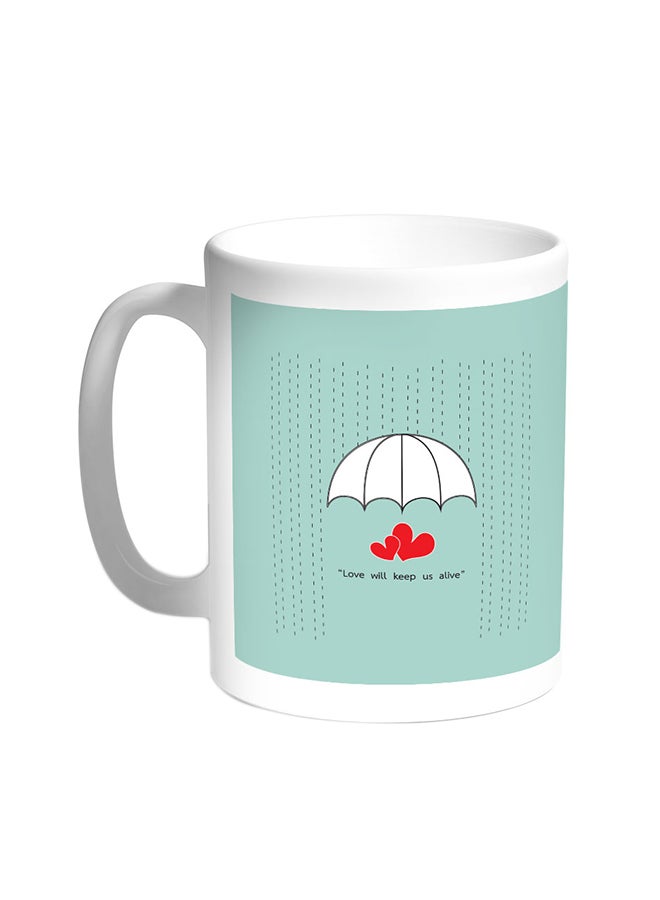 قدح قهوة مطبوع بعبارة Love Will Keep Us Alive أبيض