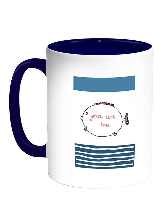 ديكالاك مج قهوة بطبعة على شكل سمكة البالون الشوكية أبيض/أزرق