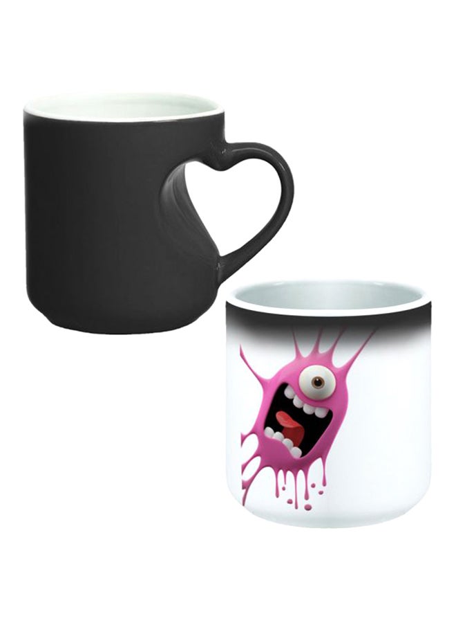 ديكالاك كوب سحري من السيراميك مزود بمقبض على شكل قلب بتصميم منحنٍ إلى الداخل أسود/ أبيض - Image 1