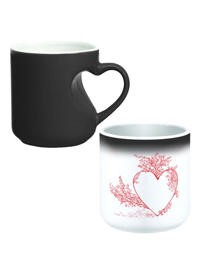 ديكالاك كوب سحري بخاصية تغير الألوان مزود بمقبض على شكل قلب أسود/أبيض - Image 1