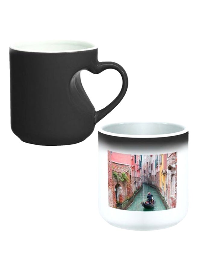 ديكالاك كوب سحري من السيراميك مزود بمقبض على شكل قلب بتصميم منحنٍ إلى الداخل أسود/ أبيض - Image 1