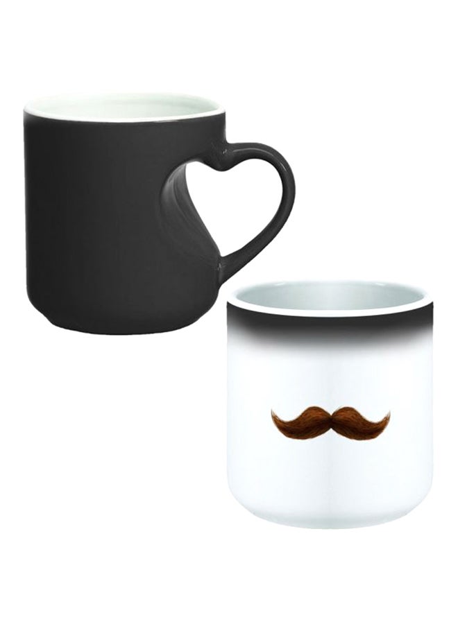 ديكالاك كوب سحري من السيراميك مزود بمقبض على شكل قلب بتصميم منحنٍ إلى الداخل أسود/ أبيض - Image 1