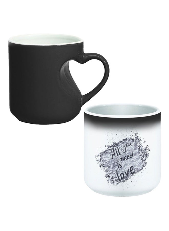 ديكالاك كوب سحري من السيراميك مزود بمقبض على شكل قلب بتصميم منحنٍ إلى الداخل أسود/ أبيض - Image 1