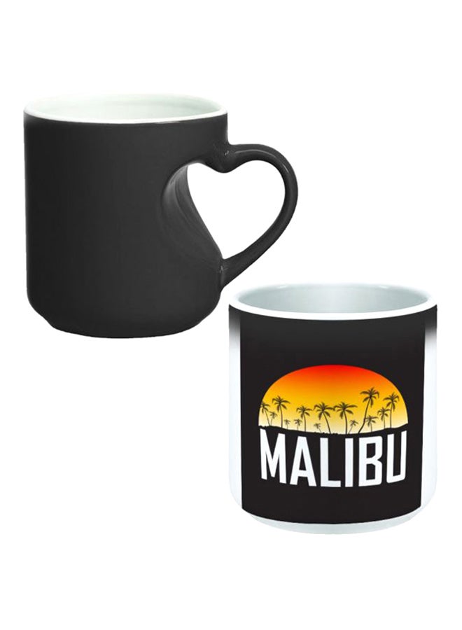 ديكالاك كوب سحري من السيراميك مزود بمقبض على شكل قلب بتصميم منحنٍ إلى الداخل أسود/ أبيض - Image 1