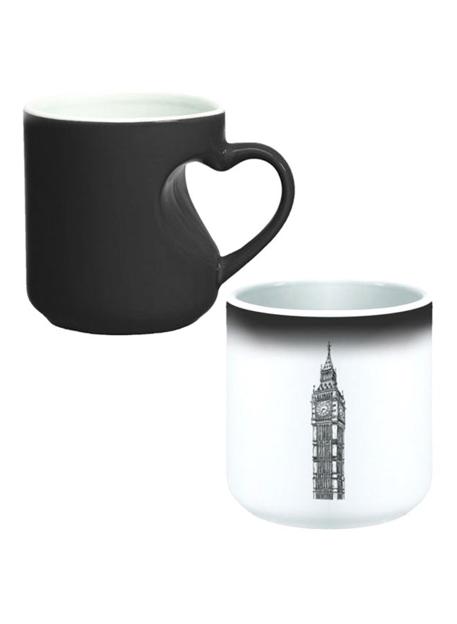 ديكالاك كوب سحري من السيراميك مزود بمقبض على شكل قلب بتصميم منحنٍ إلى الداخل أسود/ أبيض - Image 1