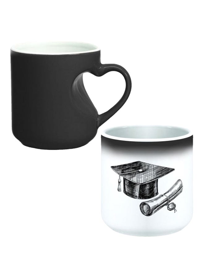 ديكالاك كوب سحري من السيراميك مزود بمقبض على شكل قلب بتصميم منحنٍ إلى الداخل أسود/ أبيض - Image 1