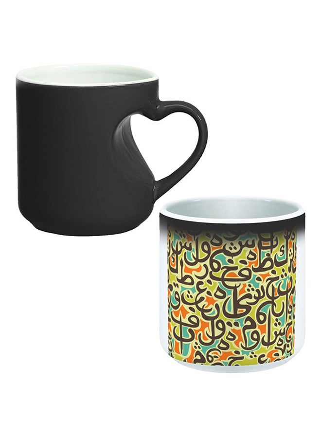 ديكالاك كوب سحري من السيراميك مزود بمقبض على شكل قلب بتصميم منحنٍ إلى الداخل أسود/ أبيض - Image 1