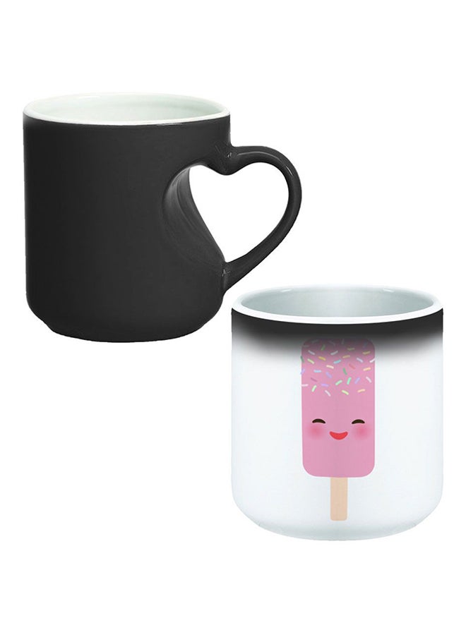 ديكالاك كوب سحري من السيراميك مزود بمقبض على شكل قلب بتصميم منحنٍ إلى الداخل أسود/ أبيض - Image 1