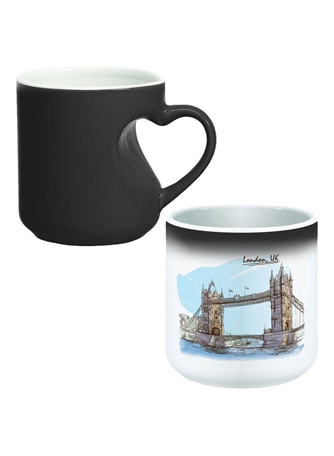 ديكالاك كوب سحري من السيراميك مزود بمقبض على شكل قلب بتصميم منحنٍ إلى الداخل أسود/ أبيض - Image 1