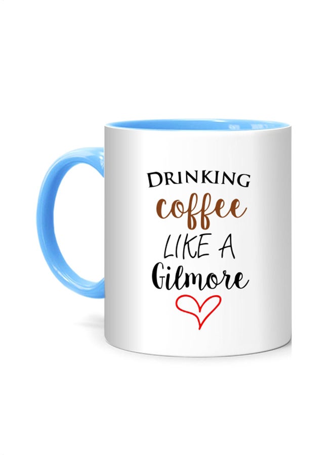 مج مطبوع عليه عبارة "Drinking Coffee Like A Gilmore" أبيض/أزرق 10سم