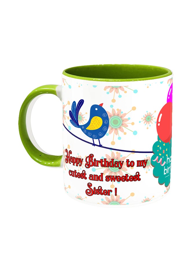 مج قهوة من السيراميك باللونين الأبيض والأخضر مطبوع عليه عبارة "Happy Birthday To Cutest Sister"