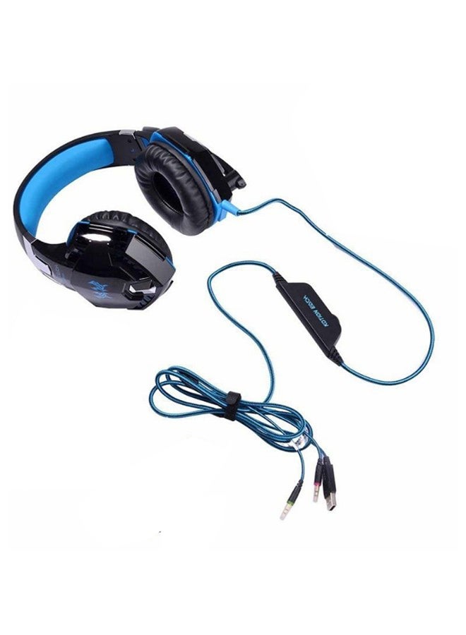 كوشن إيتش سماعة رأس ستيريو G2000 من كوشن إيتش مخصصة للألعاب وبتصميم يغطي الأذن مع طوق حول الرأس ومزوّدة بميكروفون ومناسبة للكمبيوتر الشخصي، لون أزرق - Image 1