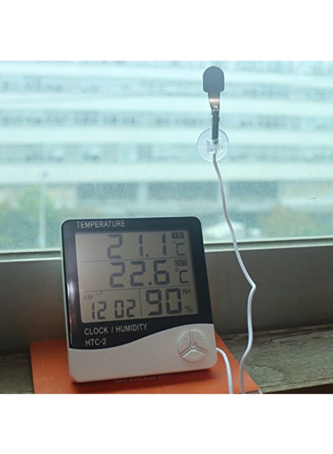 ساعة رقمية بشاشة عرض LCD مع جهاز لقياس الرطوبة ودرجة الحرارة أسود/ أبيض 10.5 x 9.8 x 2.4سم