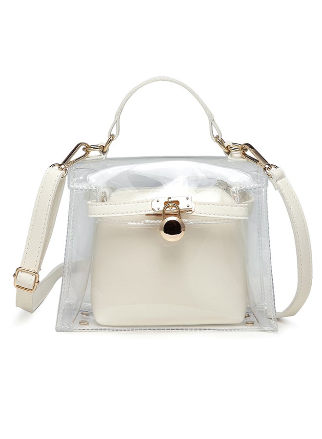 حقيبة أنيقة شفافة مزيّن بتصميم من المعدن تناسب مختلف الإطلالات فضي