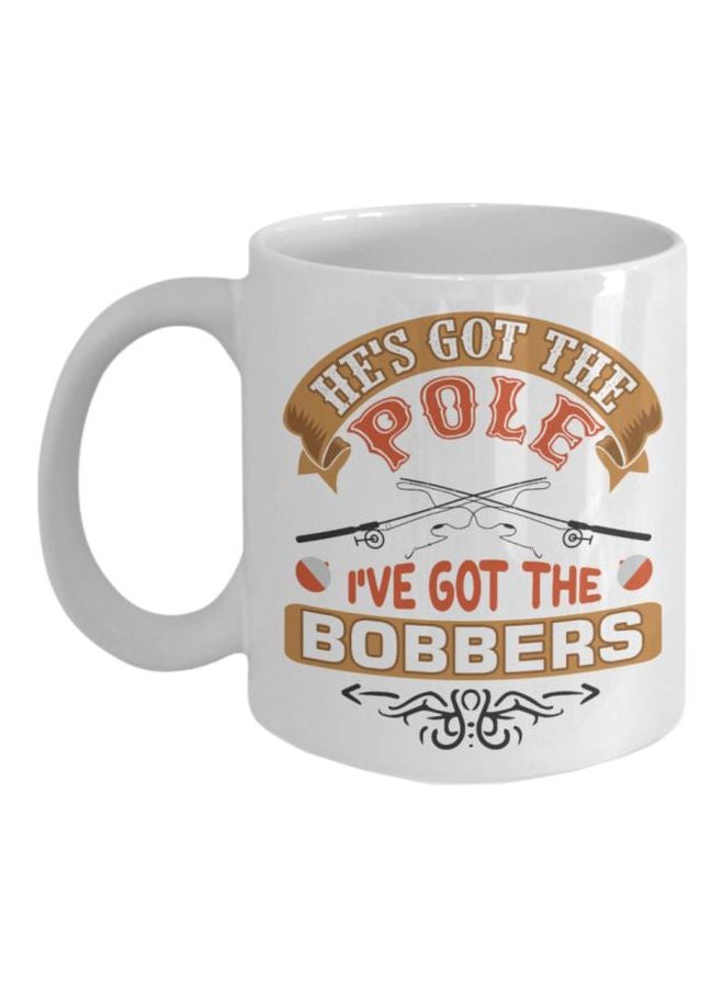 مج قهوة بطبعة عبارة "He's Got The Pole I've Got The Bobbers" أبيض/ بني/ برتقالي