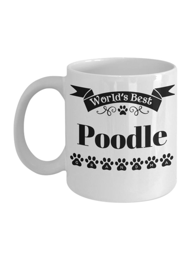 مج قهوة مزيّن بطبعة عبارة "World's Best Poodle Grandma" أبيض/ أسود 9.5x8x8سم