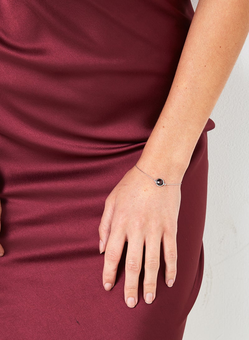 Capri Gold - 18 Karat White Gold Garnet Single Stone Bracelet - Image 1