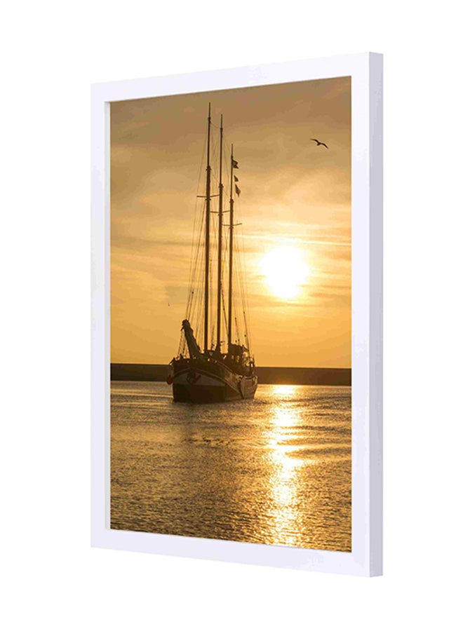 لوحة فنية لديكور الحائط بإطار خشبي تصوِّر قارباً على مسطح مائي تحت أشعة الشمس في وقت الغروب متعدد الألوان 33x43سم