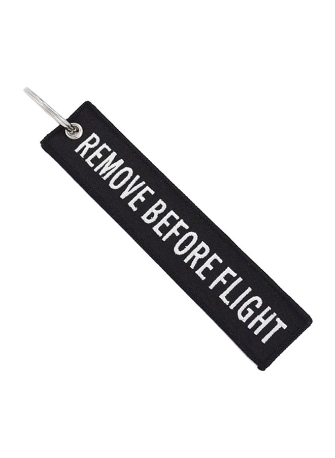 "سلسلة مفاتيح بتصميم مطرز بعبارة "Remove Before Flight"