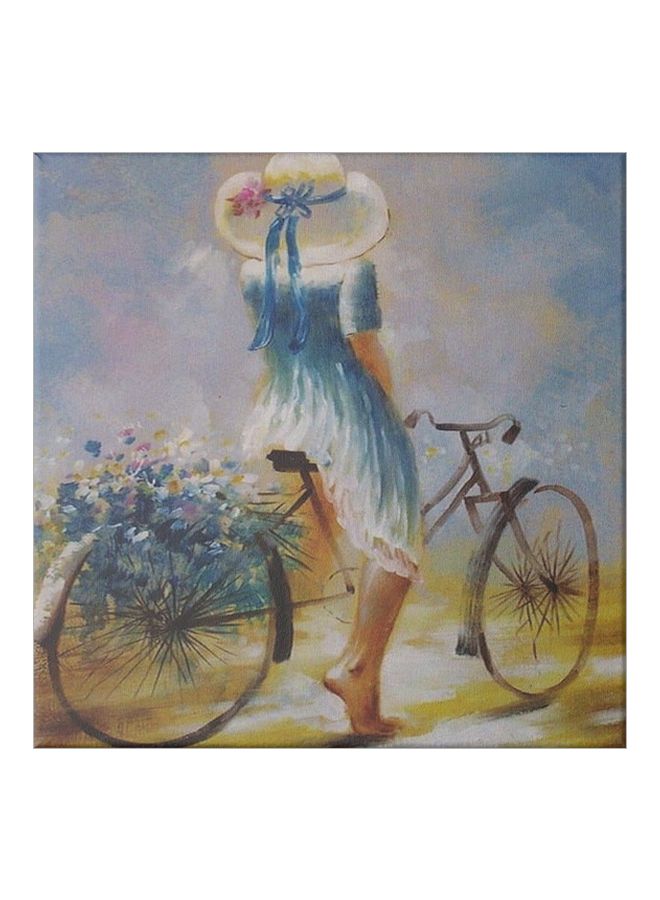لوحة فنية من قماش الكانفاس مزودة بإطار، برسمة فتاة على دراجة أزرق/بيج/رمادي 50x50سم - Image 1
