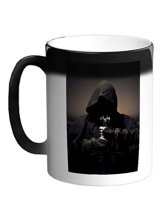 ديكالاك مج قهوة سحري بطبعة رجل غامض أسود 325ملليلتر - Image 1